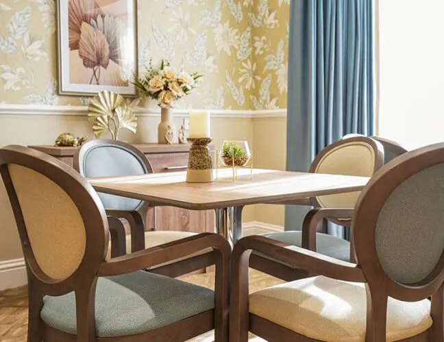 A table with four chairs at Bon Accord care home - Maven Healthcare