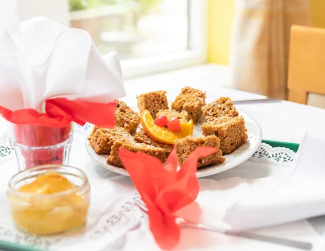 Cake on a dining table at Cypress Court care home in Crewe - Maven Healthcare