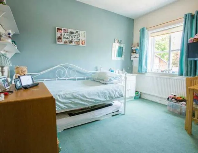 Blue painted bedroom at Hunters Lodge care home in Lutterworth - Maven Healthcare