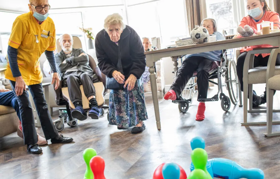 Residents play bowling at Midfield Lodge care home in Cambridge - Maven Healthcare