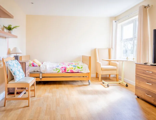 A bedroom for residents with disabilities at Midfield Lodge care home in Cambridge - Maven Healthcare