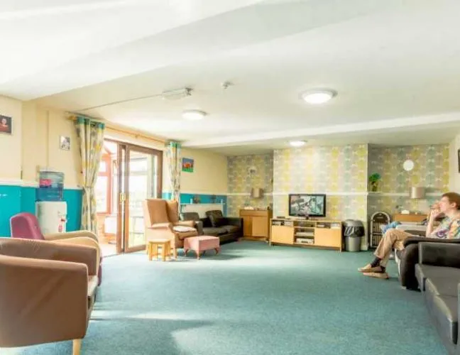 Lounge area with view of the garden in Newbarn Care Home Shropshire