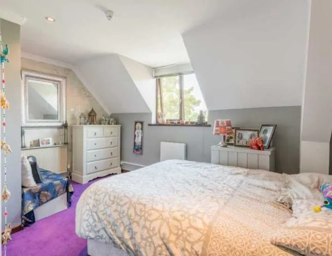 A furnished bedroom in the Newbarn Care Home in Goldstone