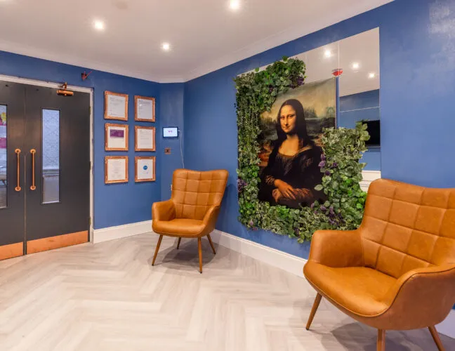 Artwork of the Mona Lisa on a wall in St Oswalds House care home, Warrington - Maven Healthcare